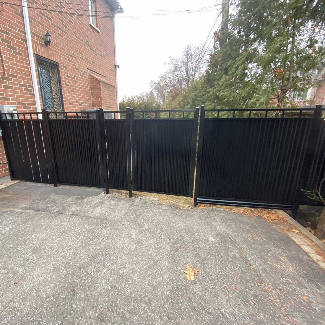 Corrugated-Aluminum-Privacy-Fence-Panels-Installed-in-Oakville-by-Toronto-Fence
